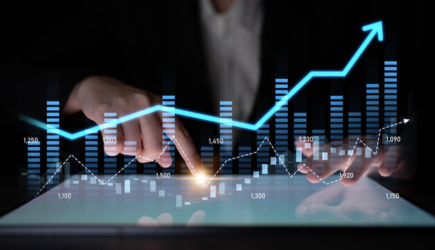 A business analyst engages with data trends on a tablet, highlighting financial graphs and statistics in a sleek modern workspace focused on growth and analysis. Scalp - Powered by Adobe