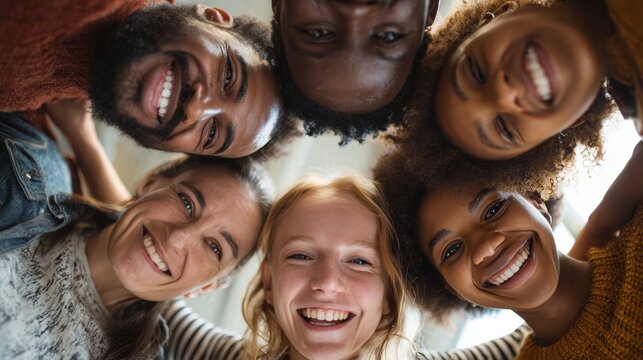Joyful group of friends celebrating together indoor setting candid photo warm environment upward angle togetherness