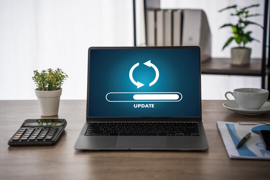 Update software application Person using laptop with software update progress interface and security, technology update digital transformation concept.