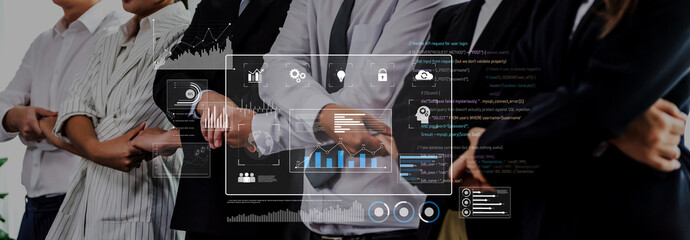 A professional team stands united in an office, demonstrating collaboration through data analysis visuals. Ideal for business and technology themes. Trope