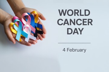 Hands holding colorful awareness ribbons for world cancer day