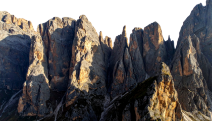 Dramatic Alpine Mountain Peaks and Rock Cliffs with Strong Sunlight Isolated
