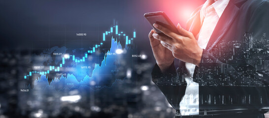 A business professional engages with a smartphone while analyzing charts and graphs of financial data against a stunning urban skyline, showcasing modern technology in finance. Scalp