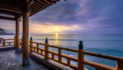 Beautiful sunrise ocean view from traditional Korean pavilion with wooden pillars