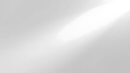 Soft light rays streaming across a textured gray background