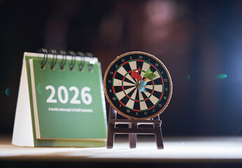 miniature dartboard and 2026 desk calendar.