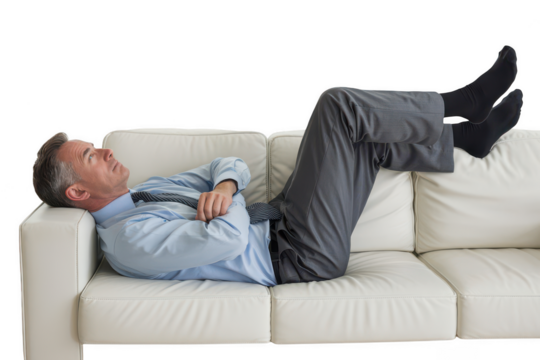 Man in suit resting on a couch, isolated on transparent background