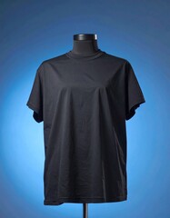 Simple Dark T-Shirt on Mannequin Against Blue Backdrop Apparel Display