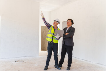 Construction Site Collaboration Between Inspector and Architect, Project Review and Planning in Unfinished Building Space