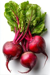 Close-up of a bunch of ripe beets with leaves isolated on a white background