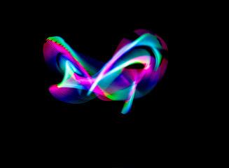 Abstract colorful light streaks and curved lines lightpainting . Abstract light art.