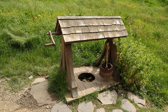  The Old wooden village well - Powered by Adobe