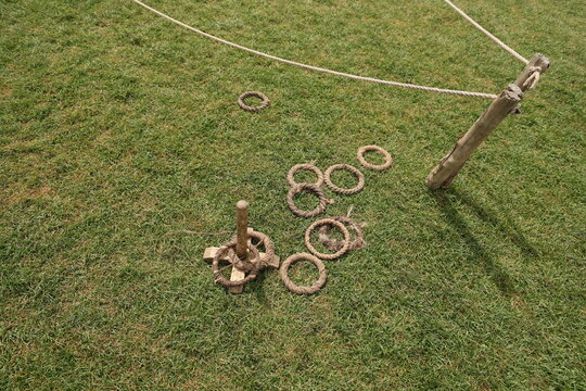 Rope ring toss game on grass field