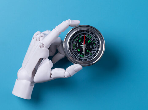 Artificial Intelligence Guiding: Robot Hand Holding Compass for Direction Technology
