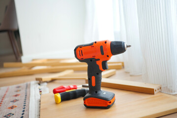 Tools arranged on a wooden surface for a DIY project