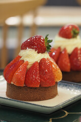 Delicious strawberry tart served on a plate in cafe