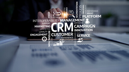 A business professional works in a modern office showcasing various CRM concepts like engagement, customer experience, and marketing strategies to drive innovation. Tessel