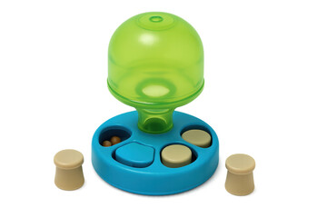 Pet puzzle feeder distributing treats for mental enrichment