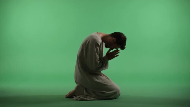Contemplative Prayer: A figure, clad in simple attire, kneels in a moment of deep devotion, head bowed in prayer, set against a calming backdrop.