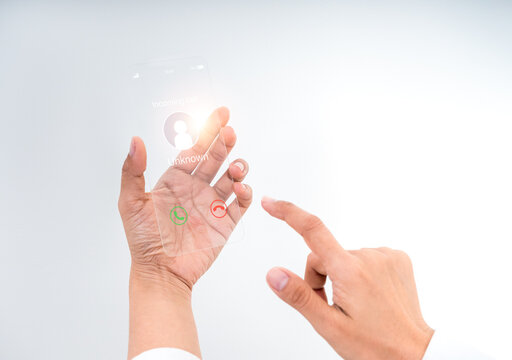 Futuristic transparent glass phone with incoming call display in human hand. Innovative concept for future technology, AR interface, digital communication, and advanced mobile user interaction design.