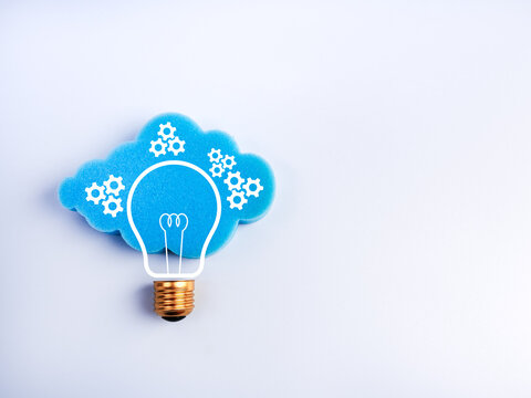 Creative cloud and lightbulb concept with gear icons on white with space, symbolizing smart cloud computing, data management, innovation, intelligent system technology in digital transformation era. - Powered by Adobe