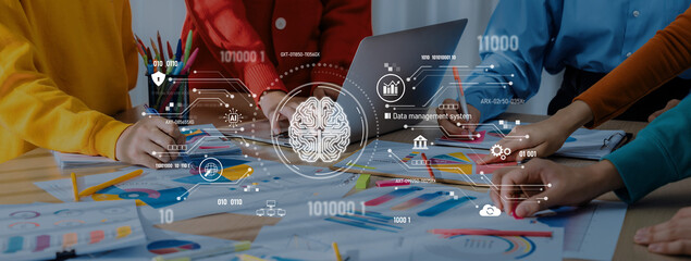 A team engages in collaborative data analysis using digital tools and visual aids. The scene captures creativity and teamwork in a modern workspace focused on insights and strategy. Trope