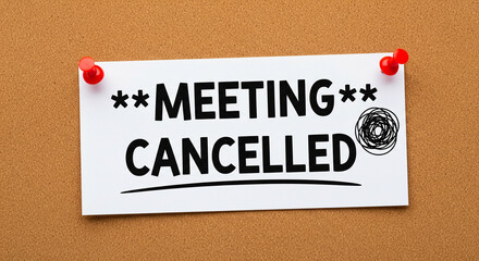 Meeting cancelled announcement pinned to a corkboard with red push pins