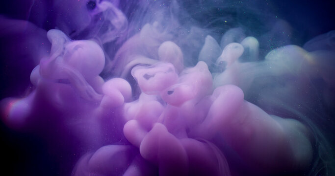 Fluid pigment. Paint water splash. Defocused purple blue colorful cloud shimmer liquid spreading on abstract acrylic art background.