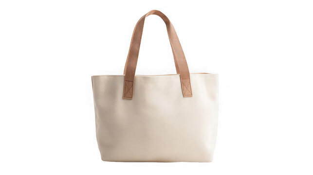 A cream colored tote bag with brown handles isolated against a black background in a studio shot - Powered by Adobe
