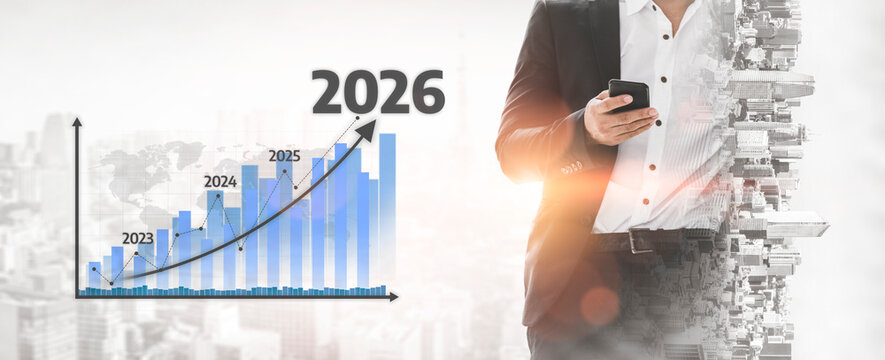 A businessman in a suit holds a smartphone against a backdrop of a financial growth chart, representing annual projections from 2023 to 2026 in an urban setting. Tessel