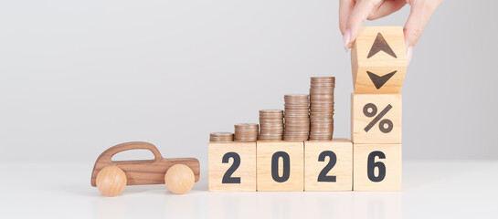 2026 New Year with percentage change to UP and Down arrow, car model and coin stack. Car loan,...