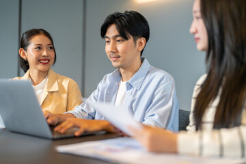 Diverse tech team meeting on software project, mentor guiding coworker on laptop, teamwork development using collaboration tools, modern technology, app design, dev training and enterprise SaaS team