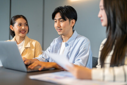Diverse tech team meeting on software project, mentor guiding coworker on laptop, teamwork development using collaboration tools, modern technology, app design, dev training and enterprise SaaS team