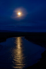 Fototapeta premium Reflection of the moon in the water at night