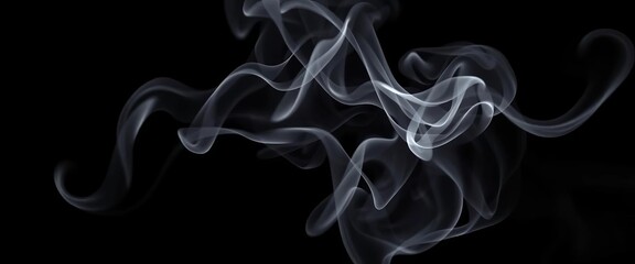 Wispy tendrils of grey smoke curl and dissipate against a stark black background, flowing, smoke