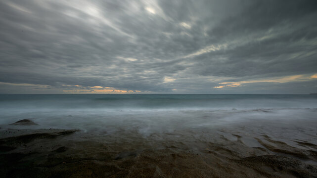 Stormy skies loom over Paralia Ierapetras at dusk in Crete..