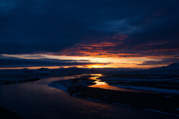 Dawn. The sun is reflected in the river.