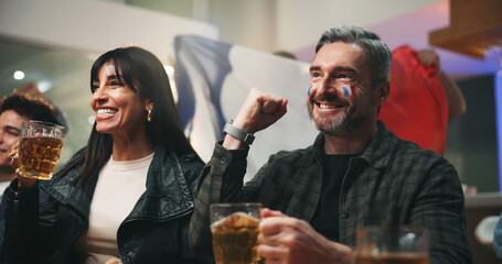 Man, beer and watching tv with celebration at sports bar, football or competition with France flag....