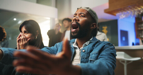 Obraz premium Sports, watching and man in pub frustrated for loss, upset for score and live streaming game. Unhappy, friends and people for team support, broadcast and match for social gathering in restaurant