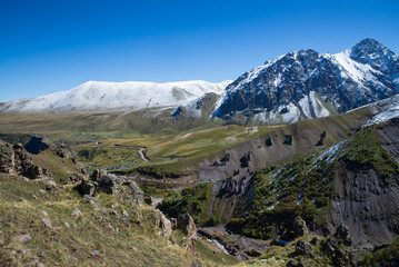 Fototapeta premium Caucasus Mountains. Mountain Journey to the northern Elbrus region. Beautiful landscapes near the climbing camp at Emmanuel Glade. 
