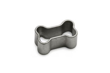 Metal dog bone cookie cutter on transparent background