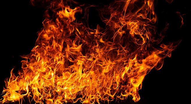 Glowing flames on black background. Inferno effect with flame. Flames with dramatic fire background. Burning flame. Intense blazing fire background. Fire abstract background with flame.