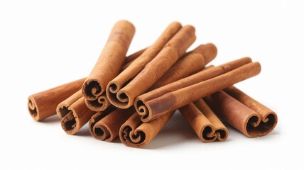 Pile of aromatic cinnamon sticks isolated on white background