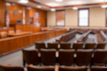 blurry photo of a large courthouse modern interior of large wooden stilts.