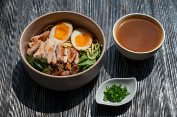 Ramen soup in a cafe. Broth separately. 