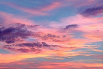 Fototapeta premium Colorful sunset sky panorama with vibrant pink, orange, and purple hues creating a serene atmosphere over a peaceful landscape