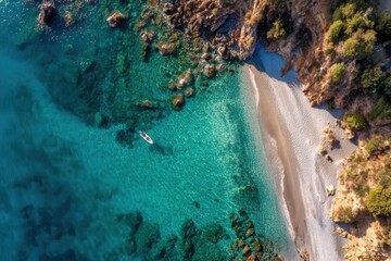 Beautiful aerial view of a secluded Mediterranean beach with calm turquoise waters, rocky shores, and a small boat on a sunny day