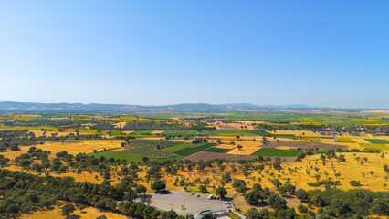 Tevfikiye, Turkey. Surrounding Ancient city of Troy agricultural fields and the Dardanelles strait in the distance on a summer day. Aerial view