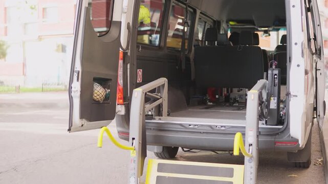 Accessible van wheelchair lift folding inside the vehicle