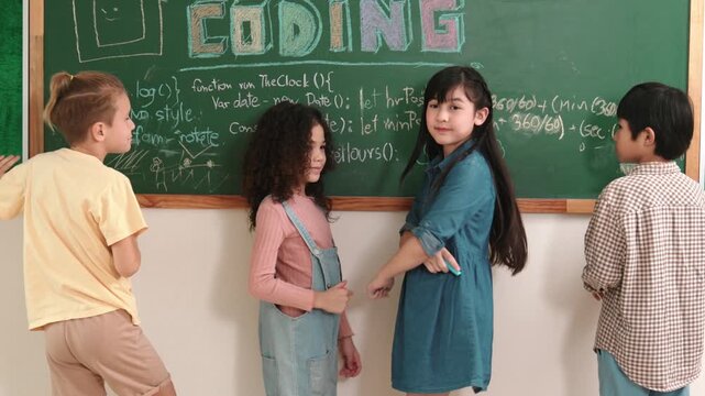 Diverse student writing board about coding engineering code and programing system to generated AI prompt and turn around to looking at camera with confident. Children learning about code. Pedagogy.